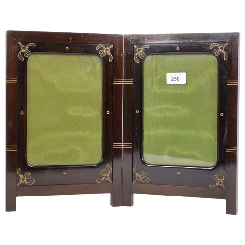 250 - An Art Nouveau stained wood double folding photo frame, with painted decoration, H33cm