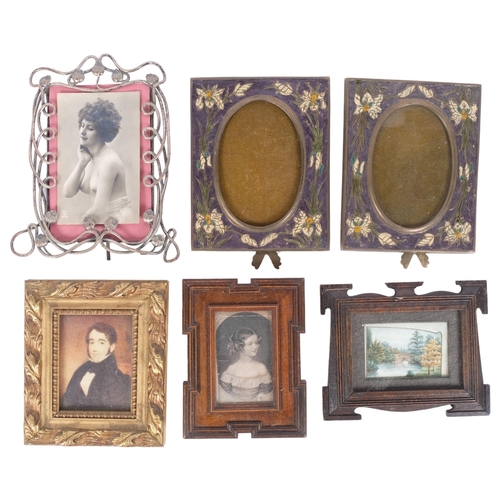 252 - A pair of Art Nouveau enamel photo frames, with brass struts, a chromed wirework photo frame, a gilt... 