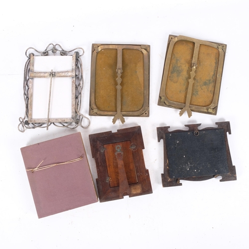 252 - A pair of Art Nouveau enamel photo frames, with brass struts, a chromed wirework photo frame, a gilt... 