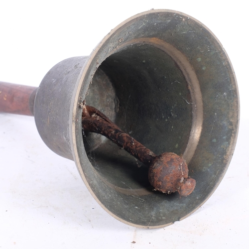 253 - An early 20th century bronze hand bell with clanger, H30cm