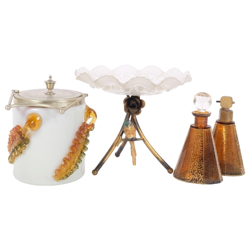 257 - An early 20th century tazza, moulded glass plate on a gilt-metal triangular stand, with parrot decor... 