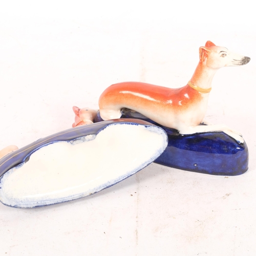 258 - A pair of Staffordshire inkwells surmounted by Greyhounds, H12cm