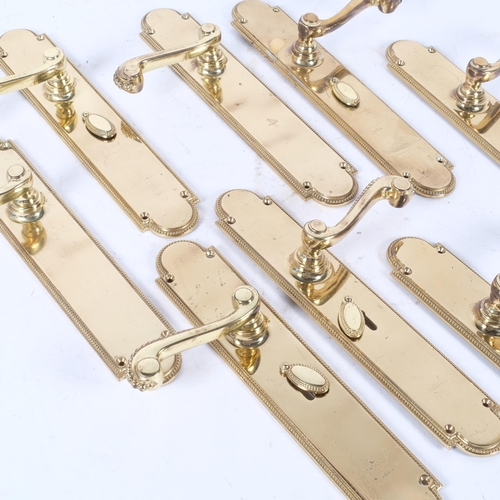 296 - 4 pairs of brass door handles, manufactured in England by Brass Art, reg. no. 978501, plate height 3... 