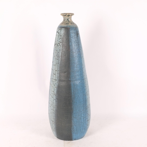 299 - A large terracotta floor standing vase, bomb-shaped with blue abstract striped decoration, unsigned,... 