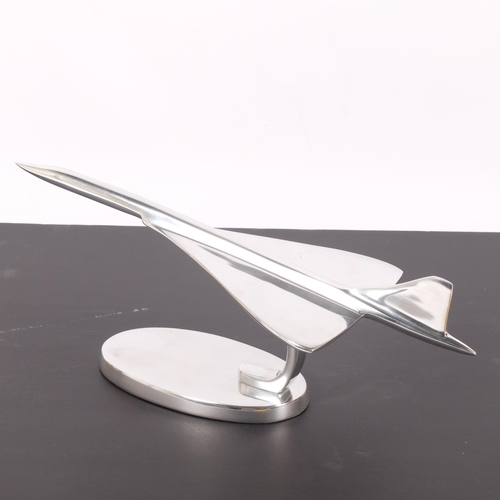 310 - A modern chrome plated desk standing sculpture of Concorde, mounted on chrome plated stand, L42cm