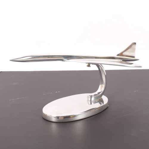 310 - A modern chrome plated desk standing sculpture of Concorde, mounted on chrome plated stand, L42cm