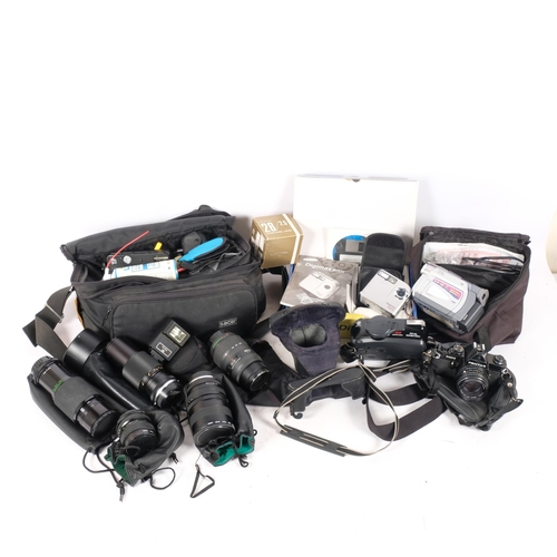 334 - A quantity of Vintage cameras and associated equipment, including a Kodak Advantix 400, A Fujifilm F... 