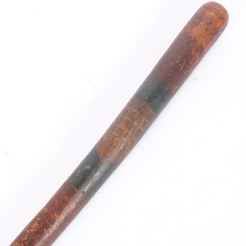 34 - A 19th century stained wood truncheon, with painted shield, L56cm