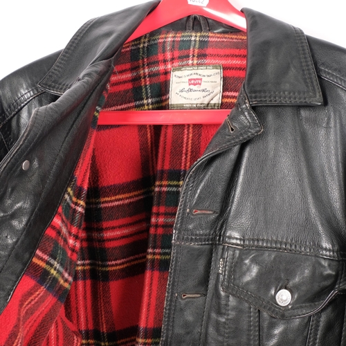 370 - A Vintage Levi's black leather jacket, tartan interior, made in Italy