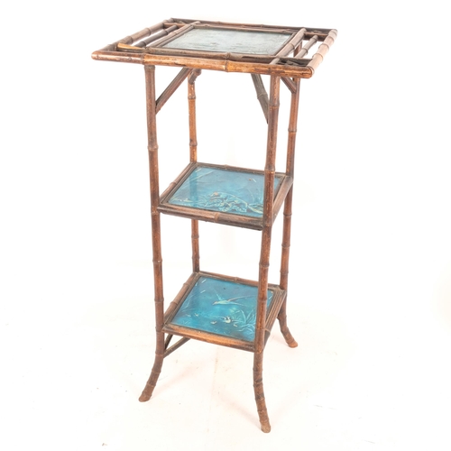 371 - A Chinese bamboo framed 3-tier stand, with 3 Art Nouveau blue glazed tiles (possibly Mintons)