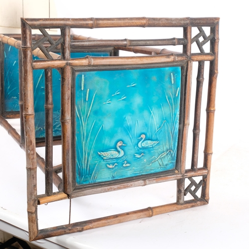 371 - A Chinese bamboo framed 3-tier stand, with 3 Art Nouveau blue glazed tiles (possibly Mintons)