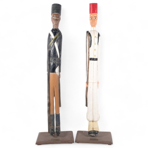 372 - A pair of carved and painted wood soldier figures