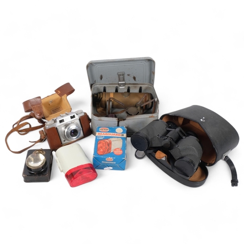 373 - A cased pair of binoculars, a Vintage petrol gas stove, etc