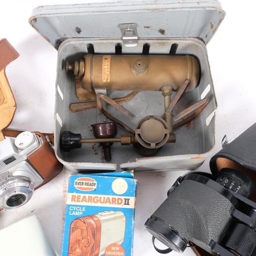 373 - A cased pair of binoculars, a Vintage petrol gas stove, etc