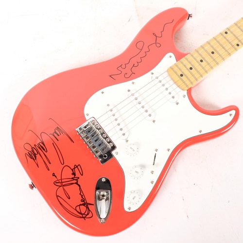 374 - OASIS interest, a signed electric Starmaker guitar with signatures from Noel and Liam Gallagher and ... 