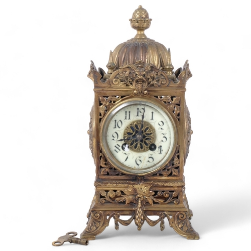 380 - An early 20th century ornate brass mantel clock, 8-day movement with enamelled dial, top of clock ha... 