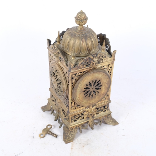 380 - An early 20th century ornate brass mantel clock, 8-day movement with enamelled dial, top of clock ha... 