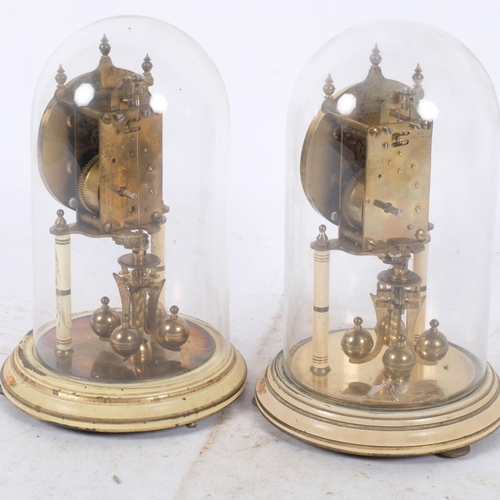 381 - A pair of ornate mantel clocks, under glass domes on wooden base, with intricate floral decoration, ... 