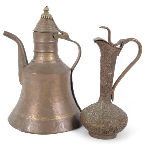 382 - A large Vintage Middle Eastern style copper ewer, H34cm, and a second brass ewer with intricate embo... 