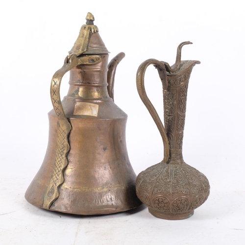 382 - A large Vintage Middle Eastern style copper ewer, H34cm, and a second brass ewer with intricate embo... 