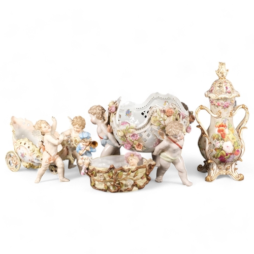 386 - A large quantity of 19th century Continental porcelain ware, various cherub decoration, and includin... 