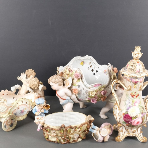 386 - A large quantity of 19th century Continental porcelain ware, various cherub decoration, and includin... 