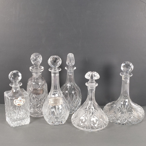 414 - A group of 6 cut-crystal decanters and stoppers, including a ship's decanter, H16cm, a ceramic Whisk... 