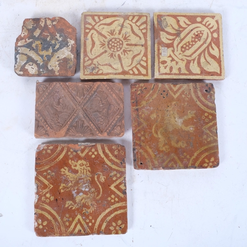 421 - Antique terracotta tiles with painted designs of lions, 14cm, and 4 others, a pair of tiles with app... 