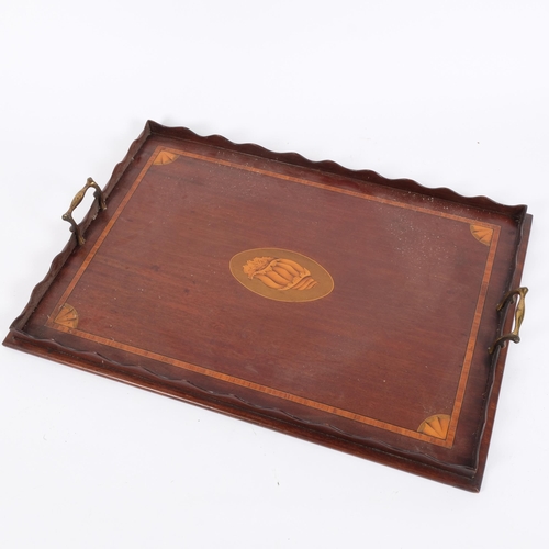 44 - An Edwardian mahogany rectangular galleried tea tray, brass handles, satinwood banding and shell mar... 