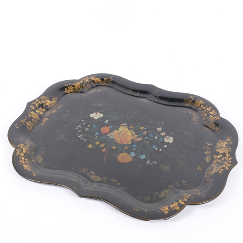 45 - A Victorian papier mache tray of shaped form, with painted floral and gilded decoration, W62cm