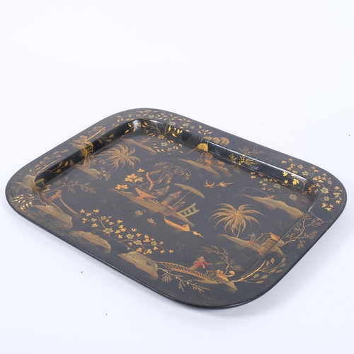 47 - A 19th century black lacquered tea tray, with a gilded and painted Oriental scene, W51cm