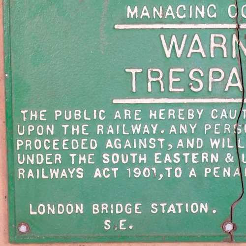 49 - South Eastern and Chatham Railway Companies Manacing Committee, a cast-iron sign (Warning Trespassin... 