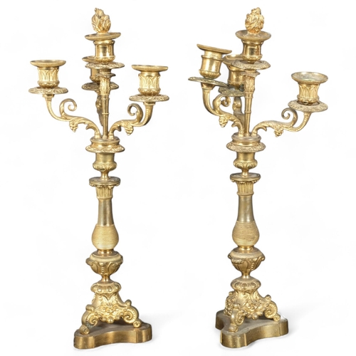 72 - A pair of Antique gilt-brass 4-branch table candelabras (missing its lustre drops), H44cm