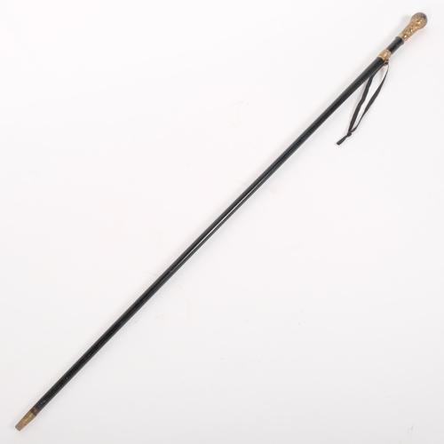 8 - A Victorian ebonised walking cane, with an embossed 18ct rolled gold handle, with an embossed collar... 