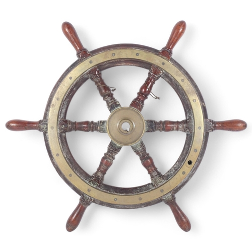 80 - An Antique teak and brass-bound ship's wheel, diameter 64cm