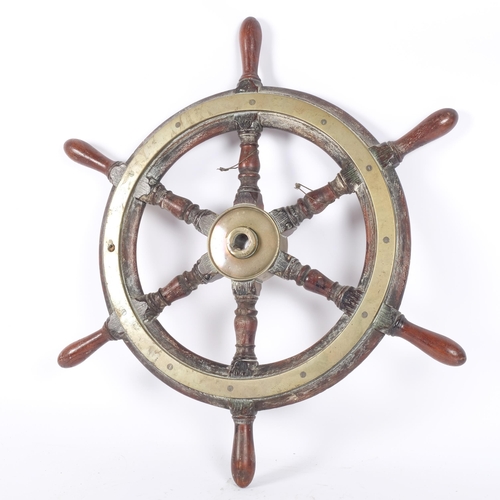 80 - An Antique teak and brass-bound ship's wheel, diameter 64cm