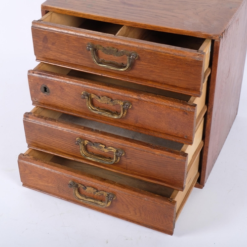 83 - An early 20th century desk-top filing chest of 4 short drawers, 31cm x 31cm x 26cm