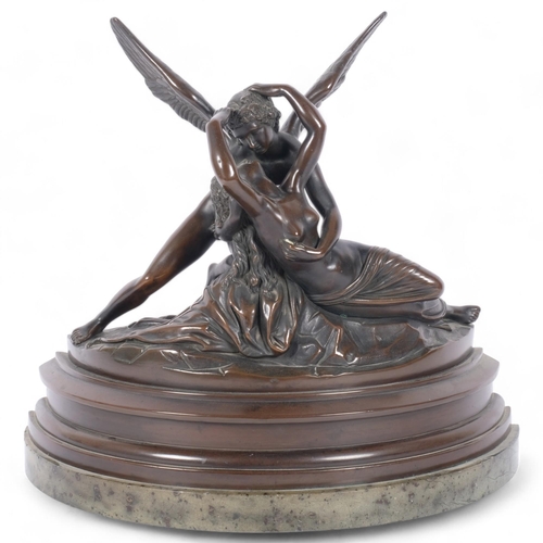 86 - A cast-bronze study of Cupid and Psyche, mounted on a green marble base of demi-lune form, H40cm