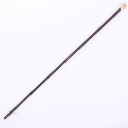 9 - An 18th century bamboo walking cane, with a carved ivory figural head, L91cm. Ivory Submission Refer... 