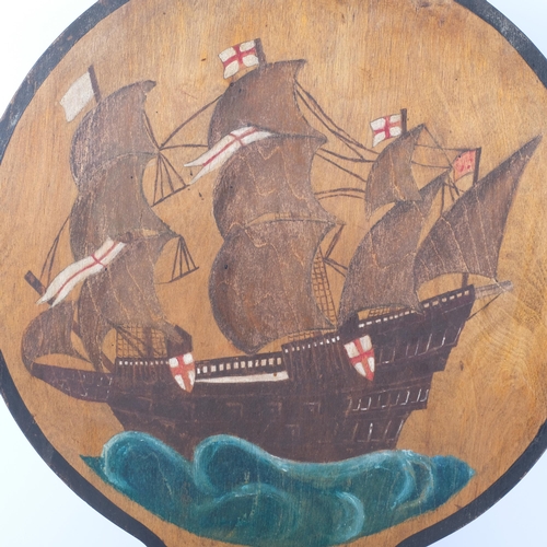 99 - An early  20th century fire screen with painted galleon decoration, H64cm