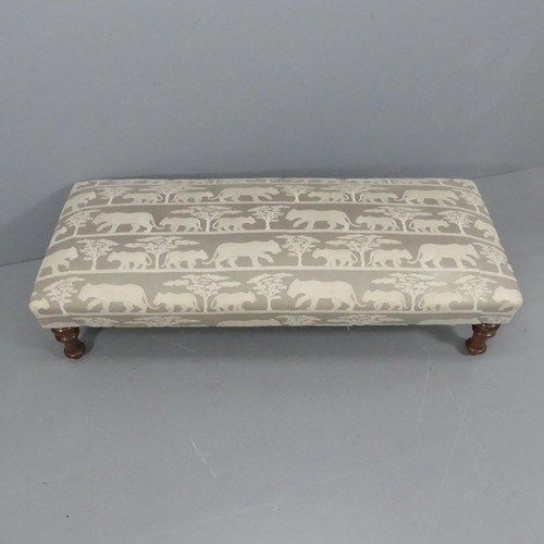 2341 - A large upholstered footstool with animal design raised on turned mahogany legs. 160x40x65cm