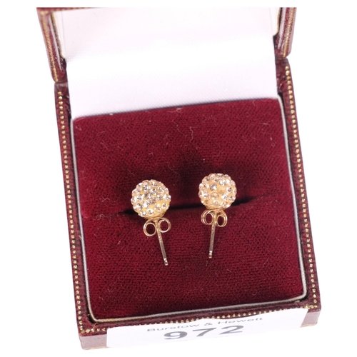 972 - A pair of 9ct gold and stone set stud earrings