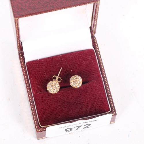 972 - A pair of 9ct gold and stone set stud earrings