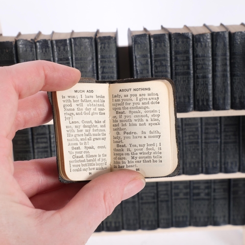 404 - A set of 40 miniature William Shakespeare books, on fitted open bookcase, H23cm