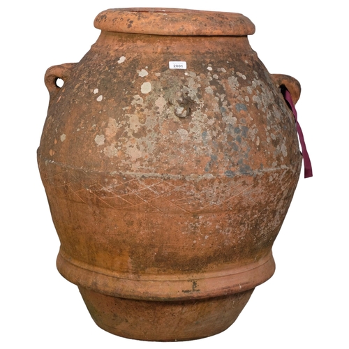 2801 - A large weathered terracotta olive oil jar, with two handles and armorial lion crest decoration. 70x... 