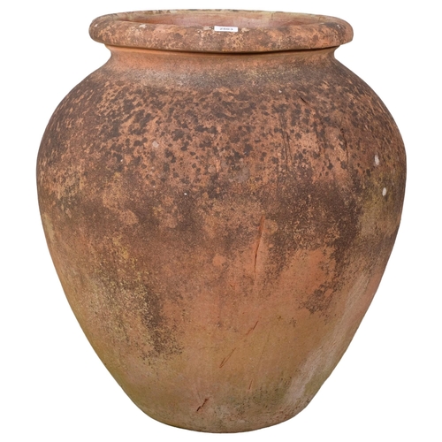 2803 - A large weathered terracotta garden urn. 70x76cm.