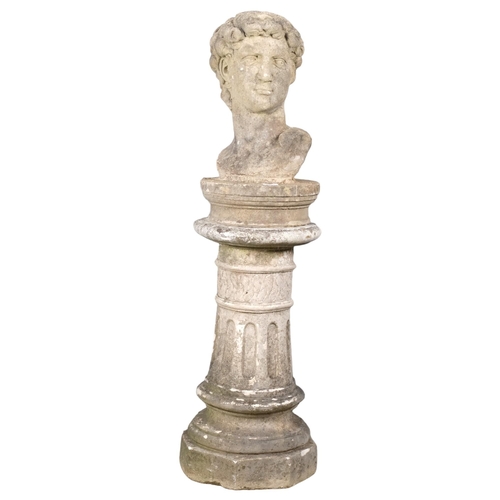 2814 - A weathered concrete bust, study of David, on associated fluted pedestal. Height overall 127cm.