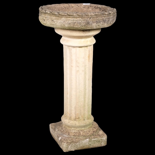 2820 - A weathered concrete two-section concrete birdbath. 41x77cm.