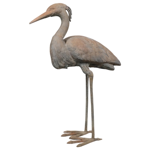 2823 - A patinated bronze sculpture, study of a Crane. Height 78cm.