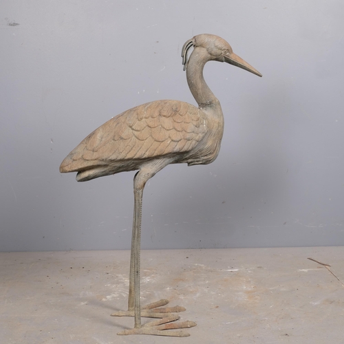 2823 - A patinated bronze sculpture, study of a Crane. Height 78cm.